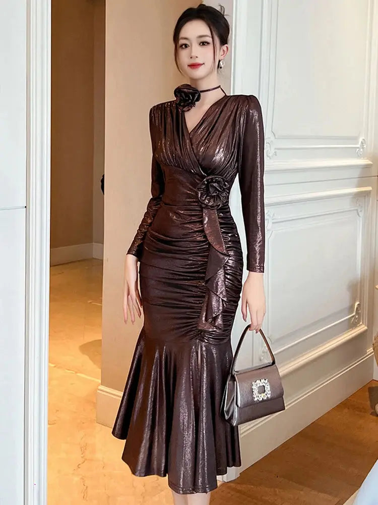Detail shot of the V-neckline on the Midnight Shimmer Dress, showcasing classic sophistication.