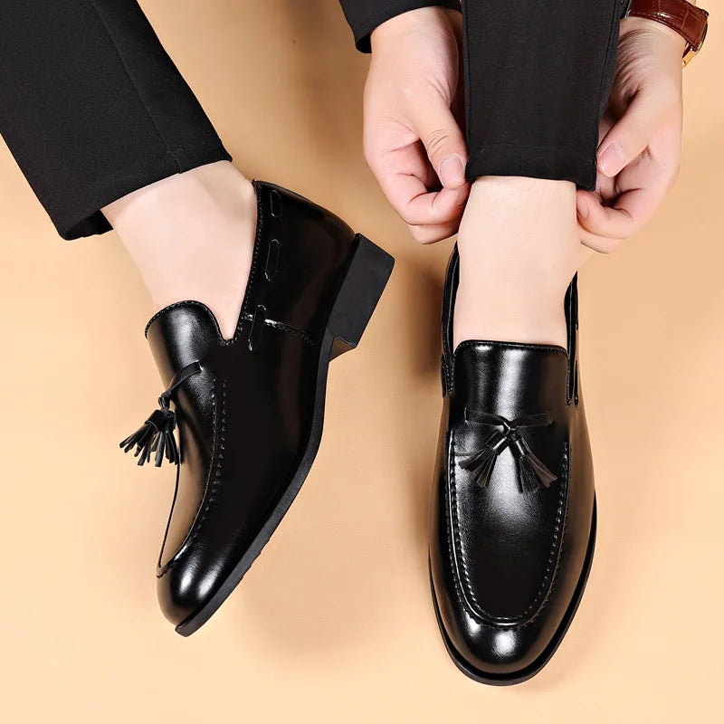 Men's dress shoes in elegant black, perfect for boardroom and wedding attire.