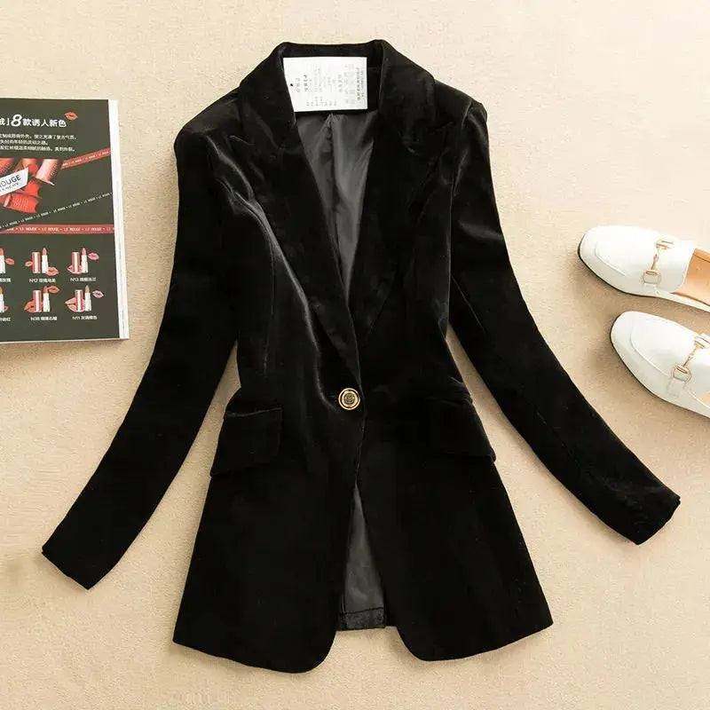 Golden velvet blazer with single-button closure, perfect for elegant evenings.