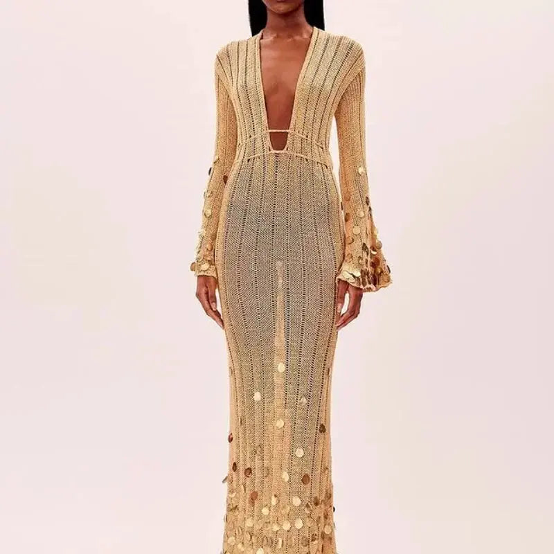 Detail shot of the see-through knit fabric on the Midnight Shimmer Maxi, adorned with sequins.