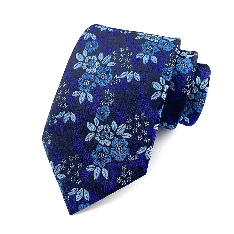 Detailed view of blue jacquard tie's intricate weaving.