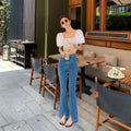 High waist flared jeans in soft stretch denim, perfect for a confident look.