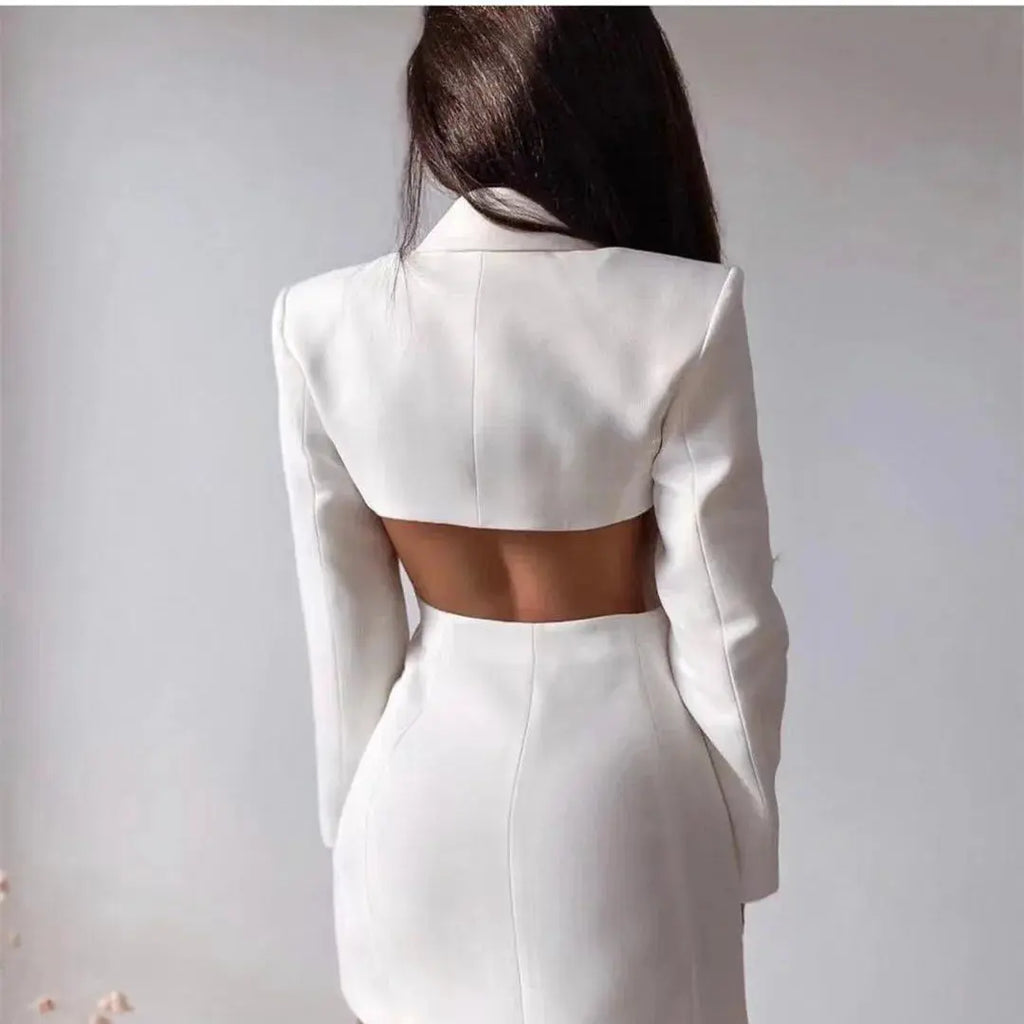 Side view of the slim fit black blazer dress, highlighting its structured silhouette and professional style.