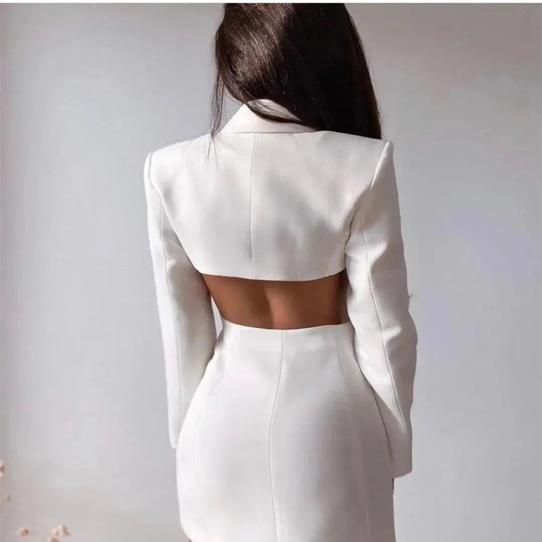 Side view of the slim fit black blazer dress, highlighting its structured silhouette and professional style.