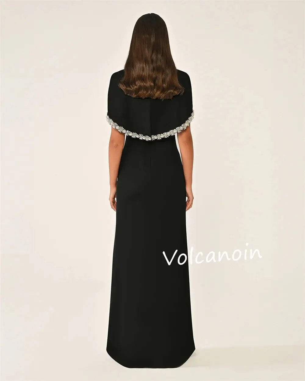 Back view of the Midnight Shimmer gown highlighting its bespoke fit and graceful flow.