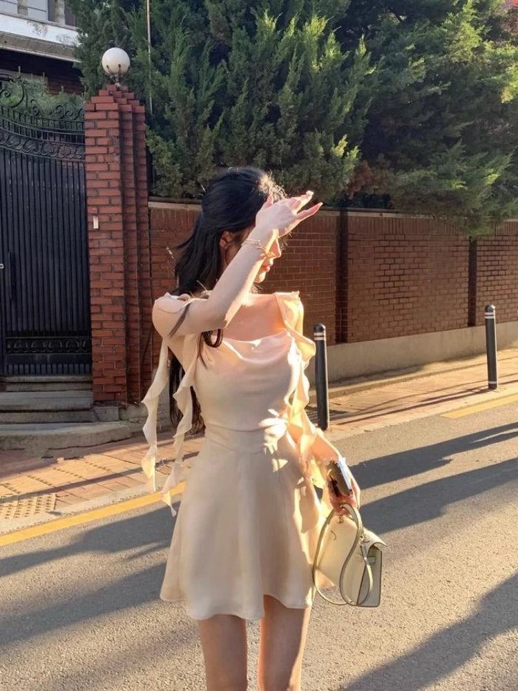 Close-up of Apricot Whisper's adjustable spaghetti straps and square neckline.