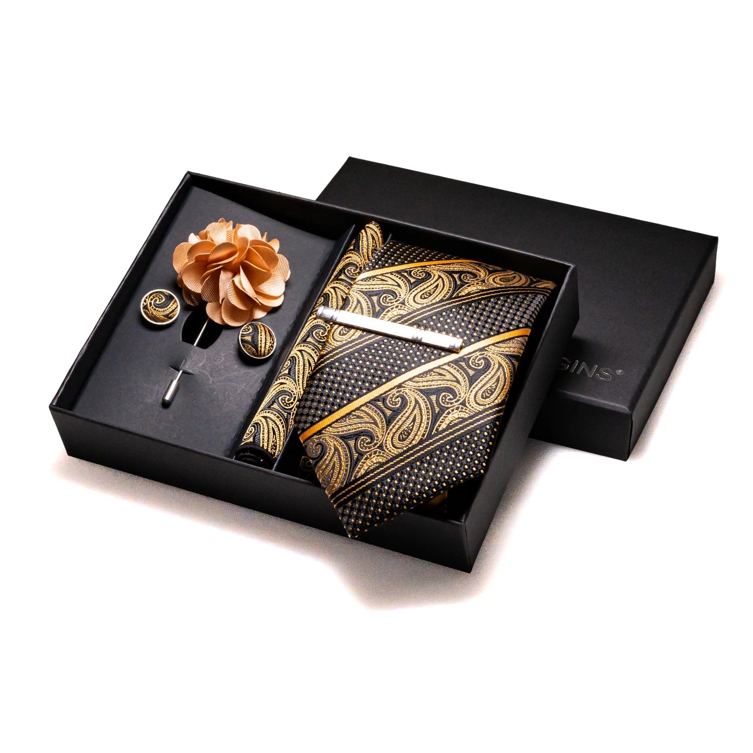 Complete formal wear set including patterned silk tie, pocket square and tie clip