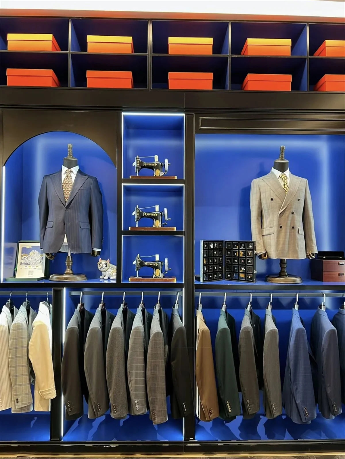 Back view of plaid slim-fit suit jacket displaying structured fit and classic British tailoring