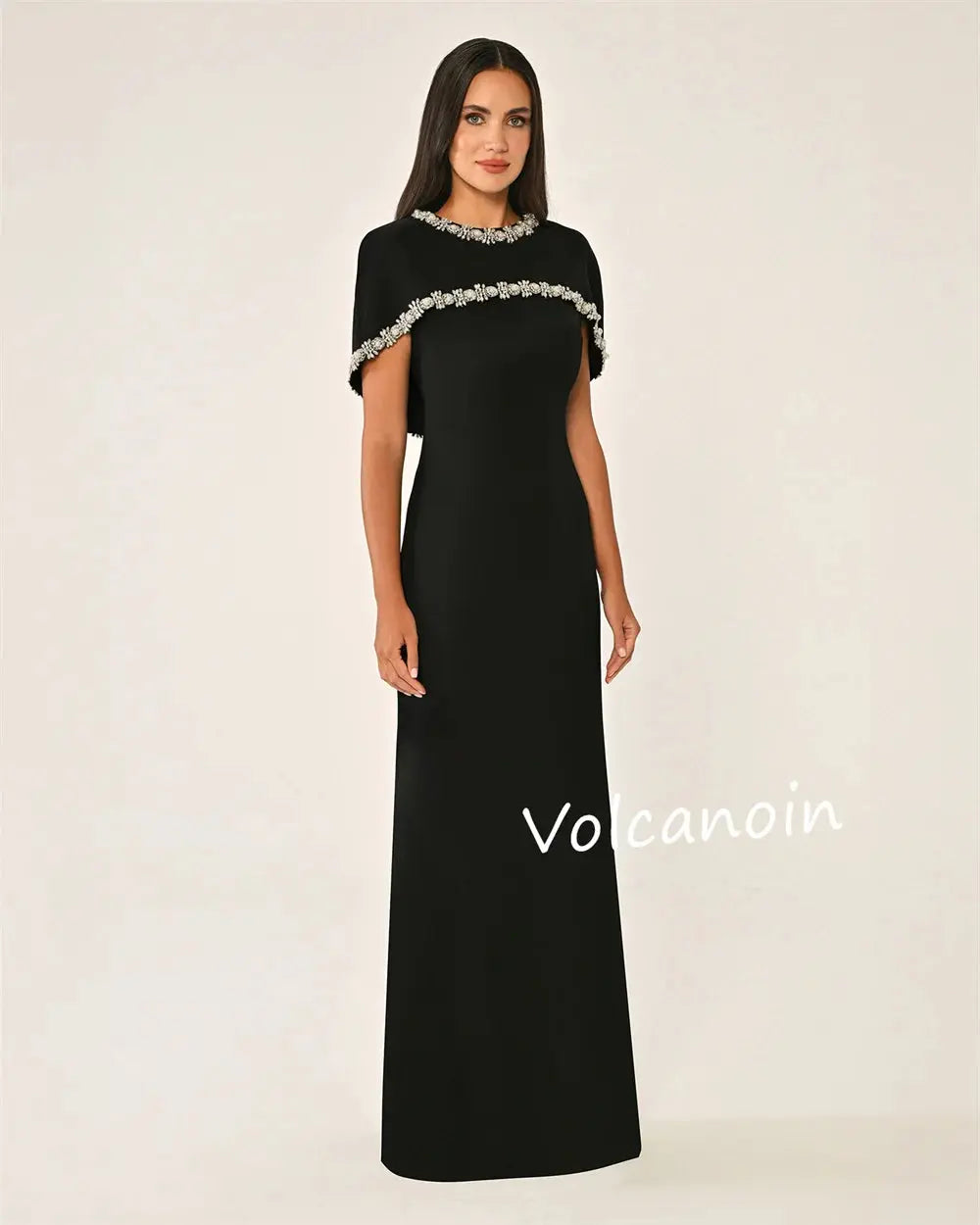 Model wearing Midnight Shimmer gown, showcasing elegant floor-length design.