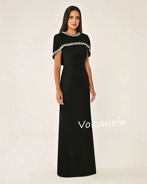 Model wearing Midnight Shimmer gown, showcasing elegant floor-length design.