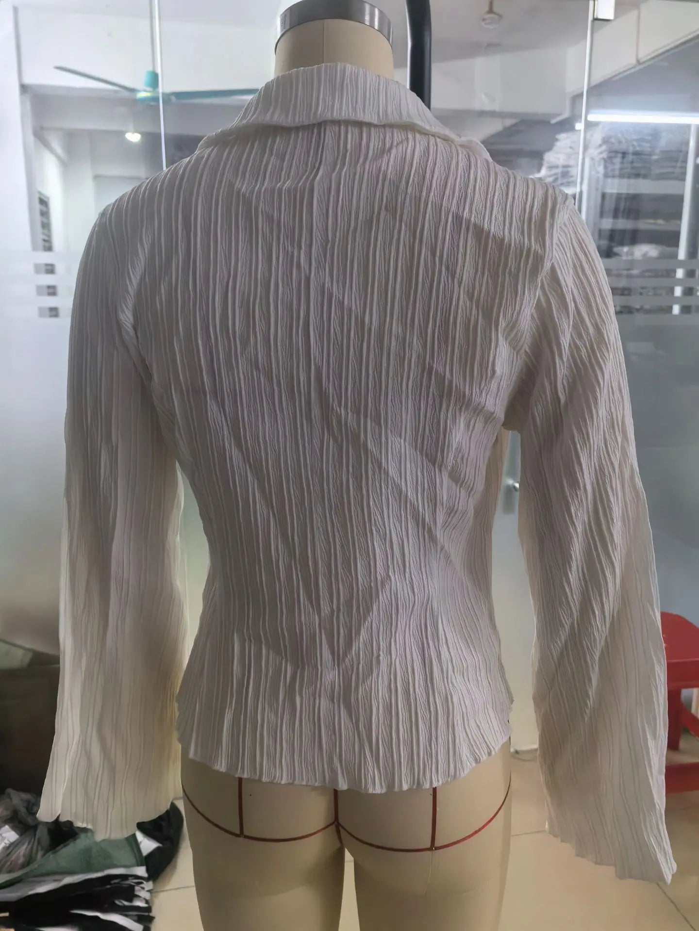 Classic peplum blouse with turn-down collar styled with high-waisted trousers