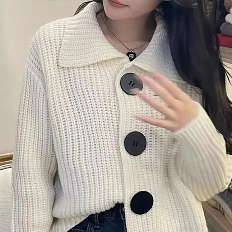 Button-up design of the Autumn Whisper Cardigan showcasing vintage charm and comfort.