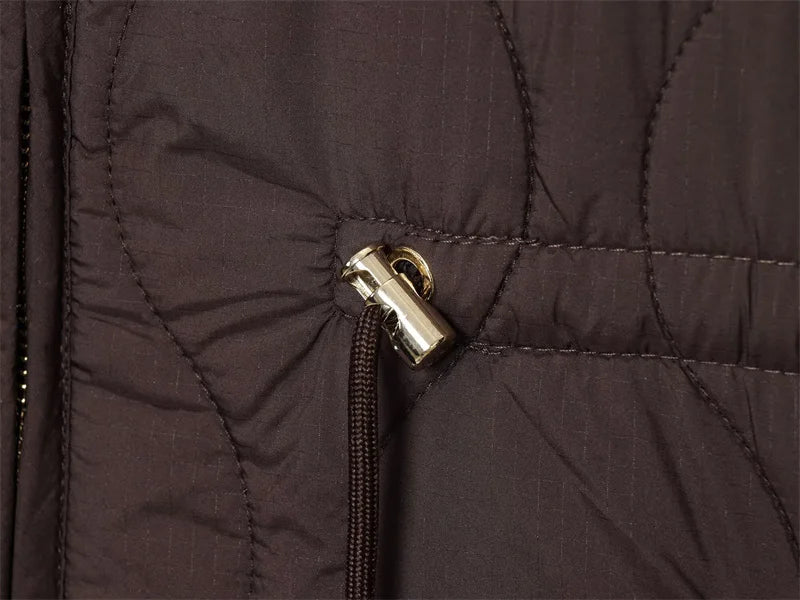 Close-up of the soft polyester fabric of the Autumn Whisper coat, ensuring comfort.