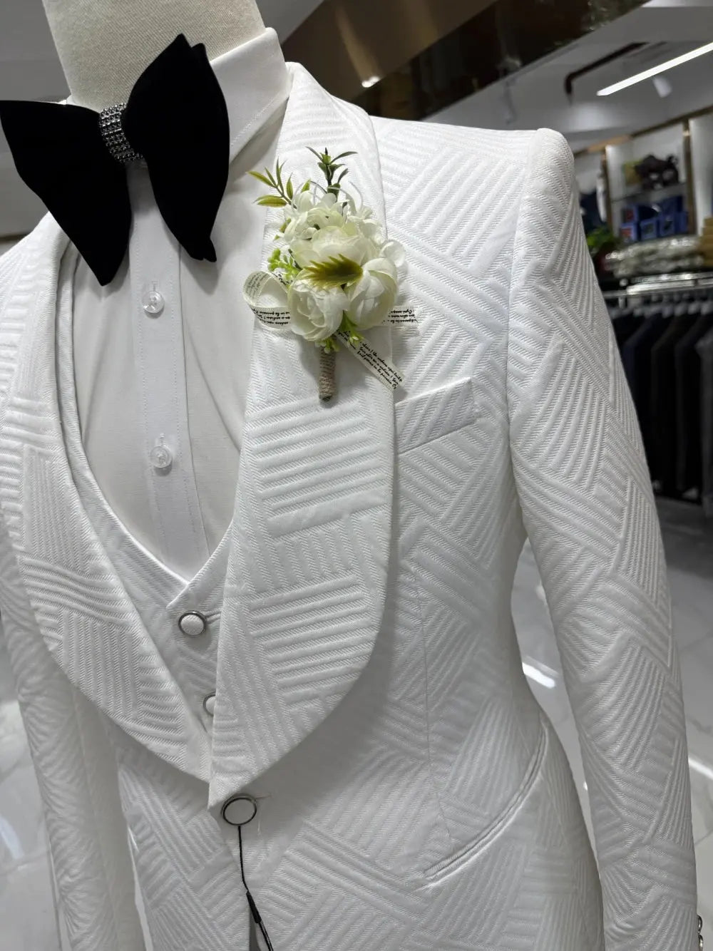 Stylish men's three-piece suit in white jacquard, ideal for business formal attire.