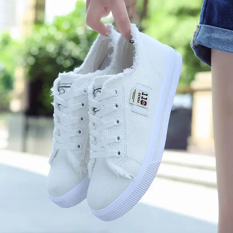 Round toe canvas sneakers in pastel colors, combining fashion and comfort.