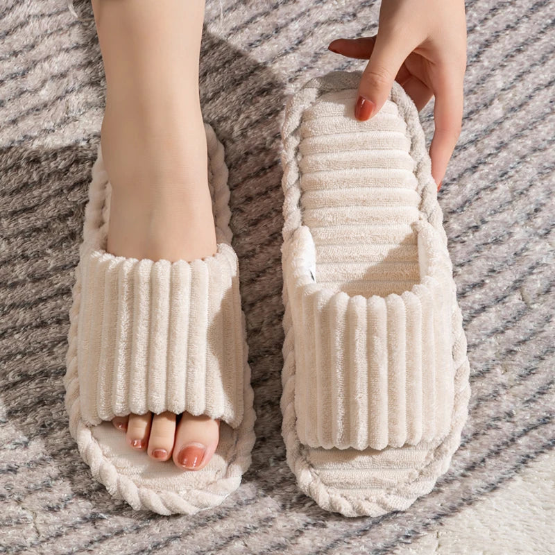 Soft beige cozy corduroy slippers, designed for quiet movement indoors.