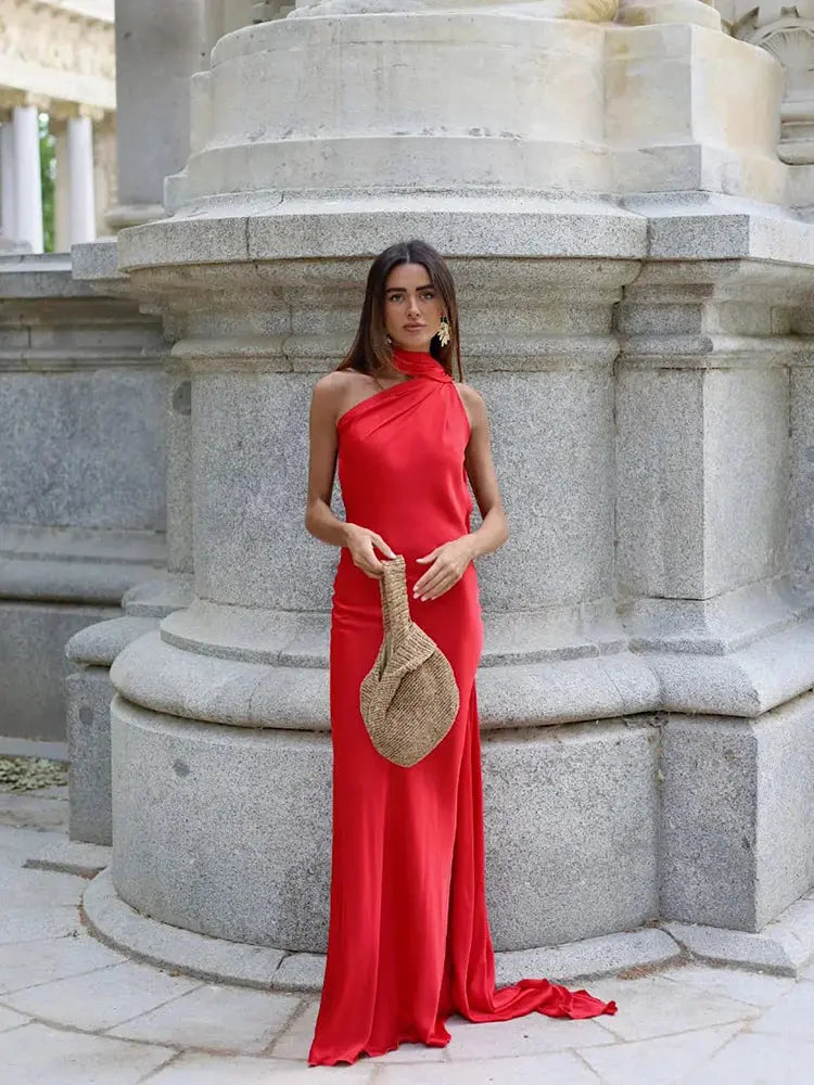 Midnight Allure Halter Gown draping elegantly on a mannequin.