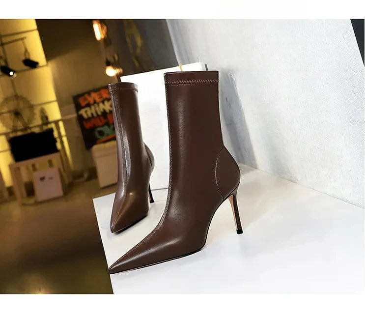 Timeless leather mid-calf boots with elongating pointed silhouette