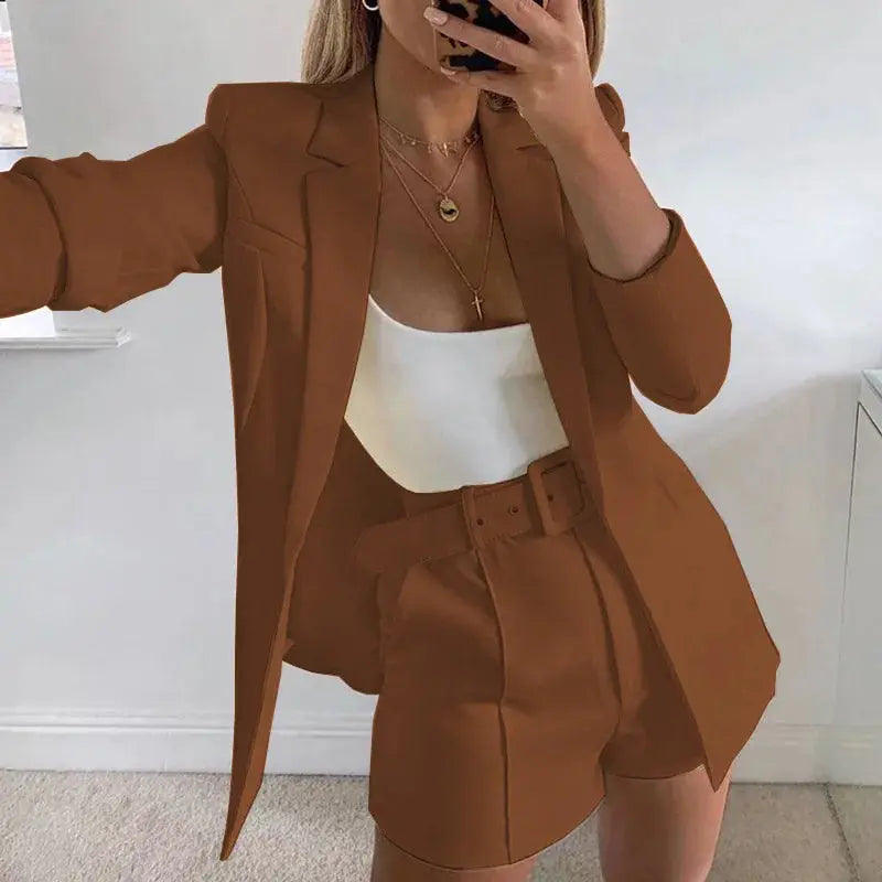 Navy blazer and tailored shorts, perfect for transitioning between seasons.