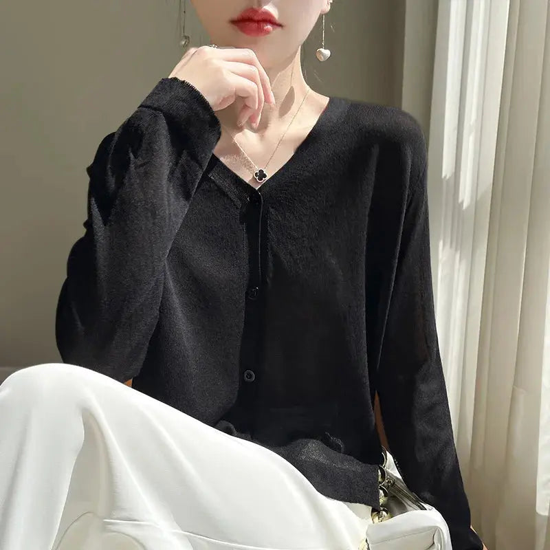 Single-breasted V-neck design of the Breeze Whisper Cardigan, showcasing its elegant silhouette.