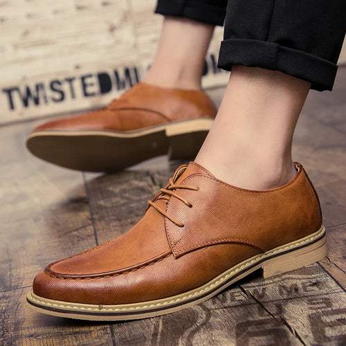 Black leather derby shoes with soft rubber sole and classic lace-up design on white background