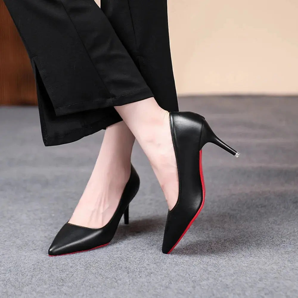 Side view of stylish black heels highlighting their sturdy support and slim design.