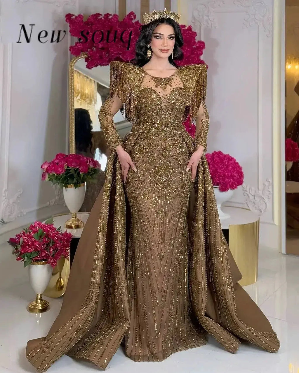 Elegant mermaid gown in shimmering sequined fabric with a high neckline and full sleeves.