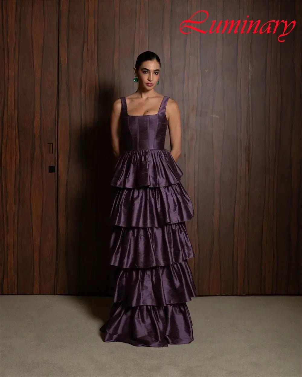 Back view of the satin evening gown featuring a flowing sweep train, ideal for weddings and galas.