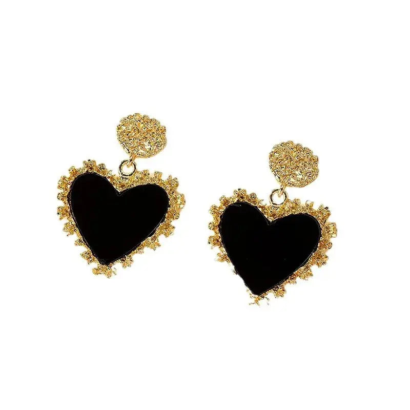 Elegant Heartfelt Whispers Dangle Earrings, perfect for romantic dinners, featuring a timeless heart design.