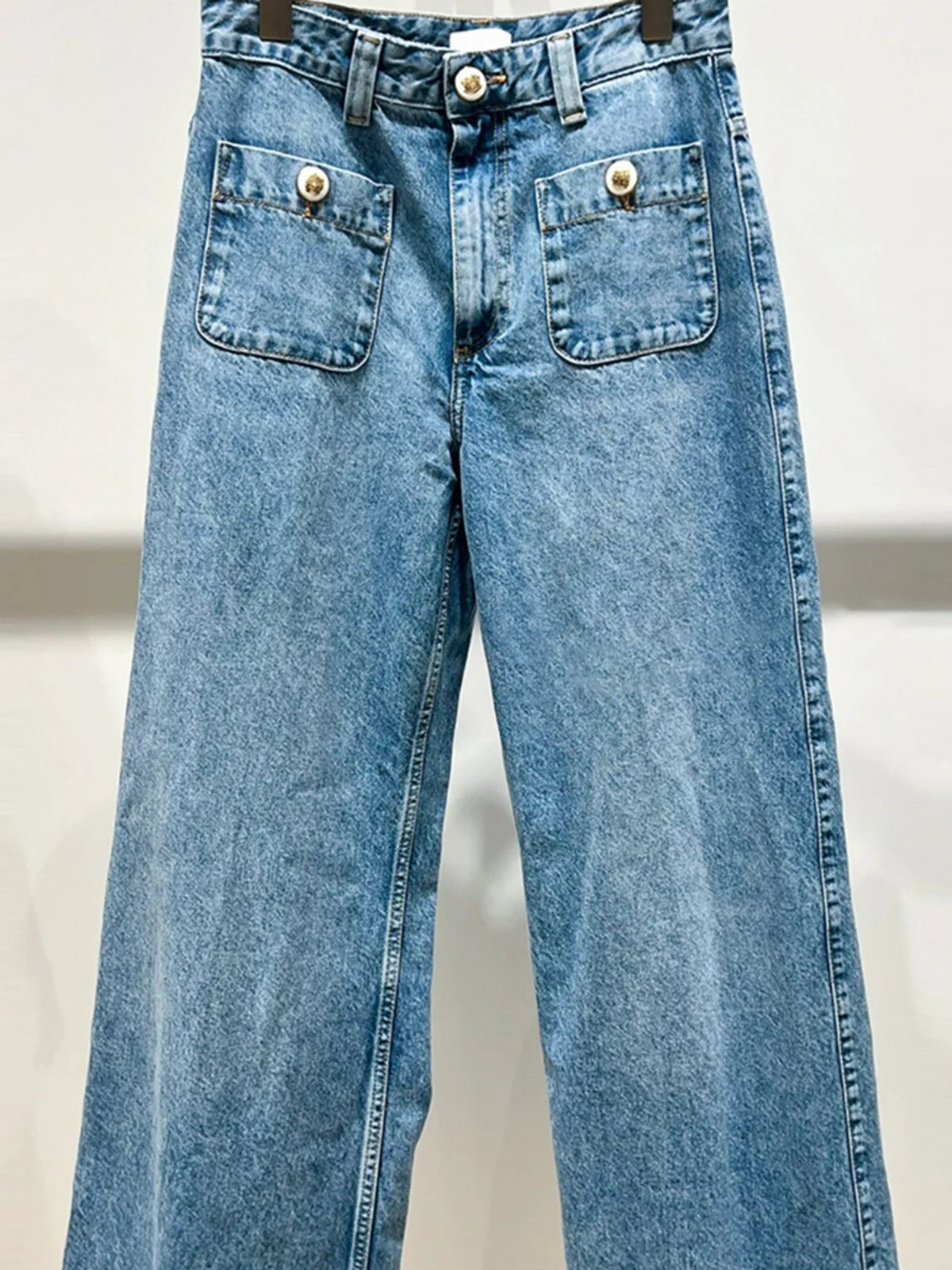 High-waist jeans showcasing a flattering silhouette and vibrant blue hue.