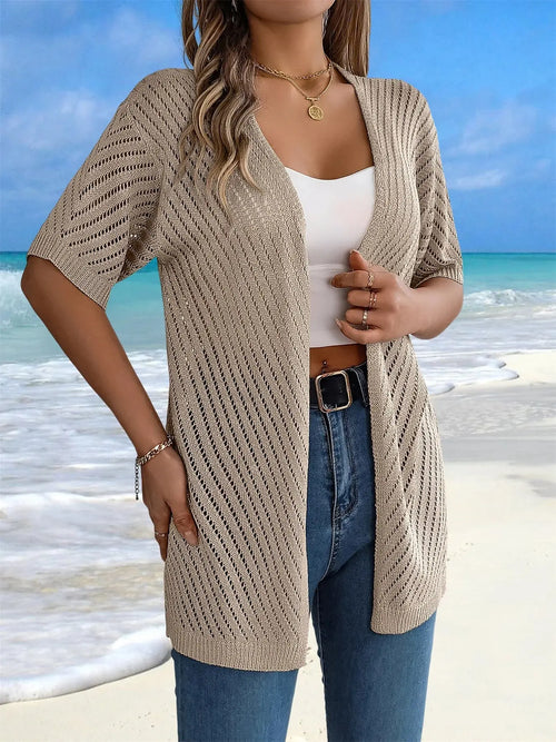 Lightweight viscose crochet cardigan in soft cream, perfect for summer layering.