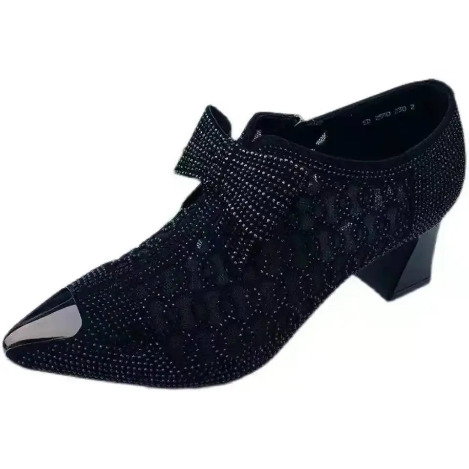 Back view of black rhinestone heels, emphasizing their sculpted comfort and style.