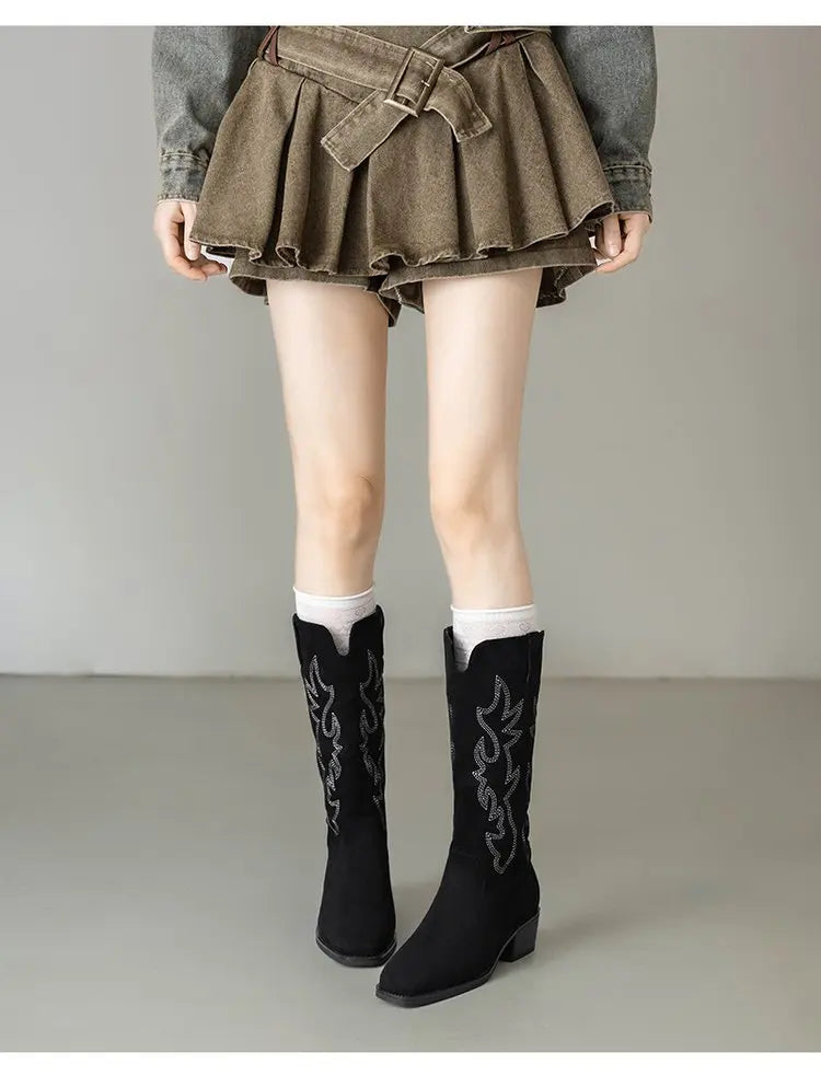 Embroidered cowboy boots styled for evening cocktails and night out