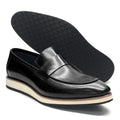 Detail shot of premium leather penny loafer stitching and timeless penny strap design