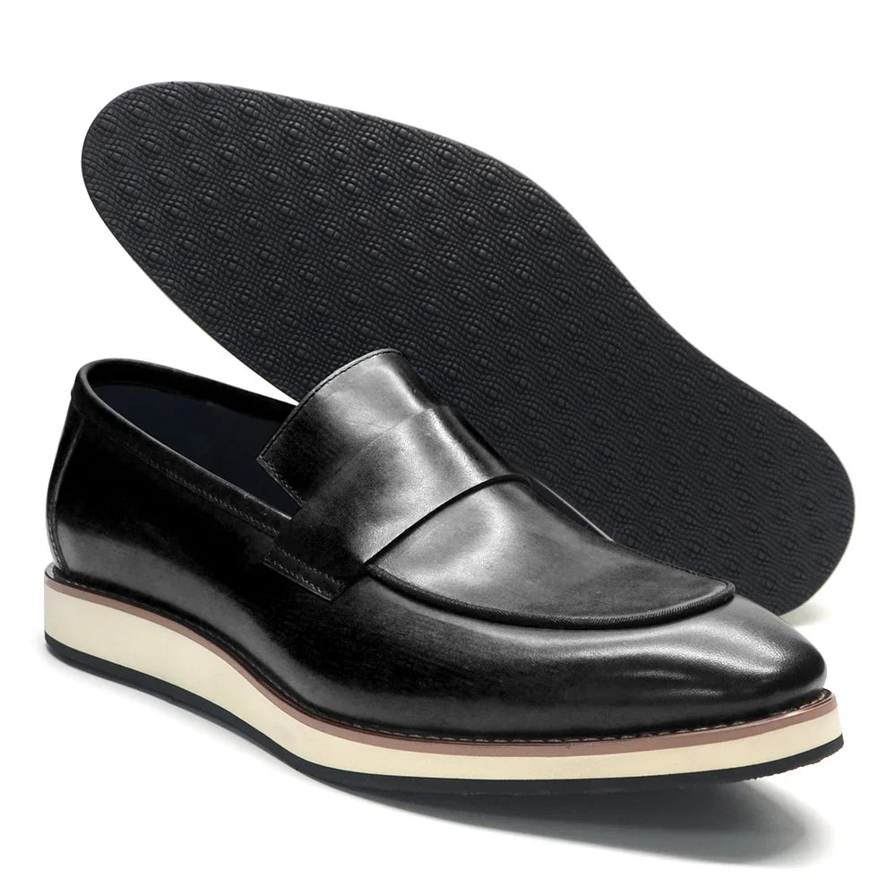 Detail shot of premium leather penny loafer stitching and timeless penny strap design