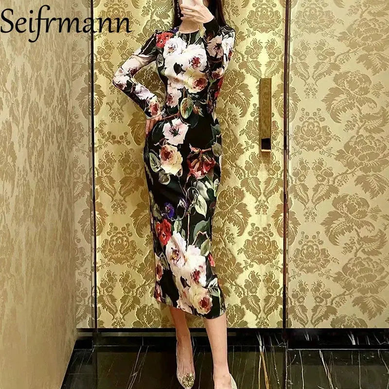 Midnight floral silk dress showcasing vibrant vintage print and elegant mid-calf length.