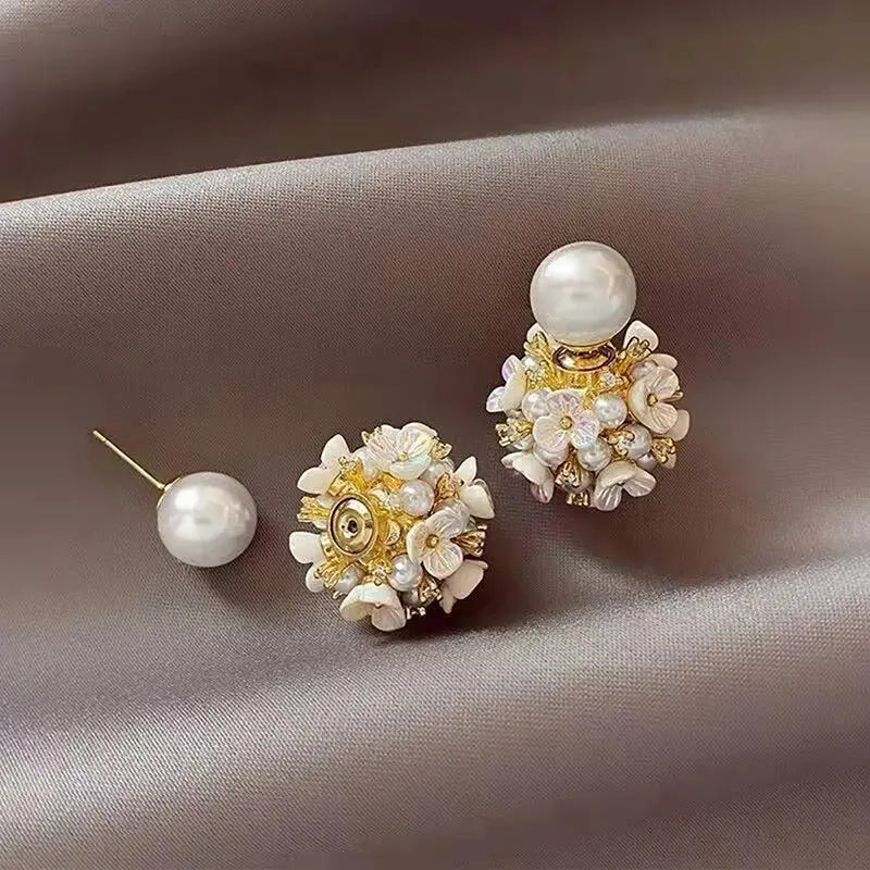 Chic wedding accessory, these pearl ball earrings add a soft glow to any outfit.