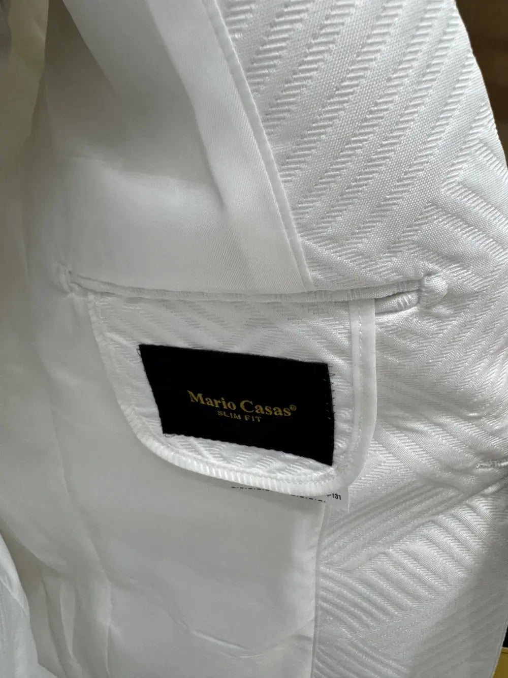 Model wearing a white jacquard ensemble, exuding confidence and modern sophistication.