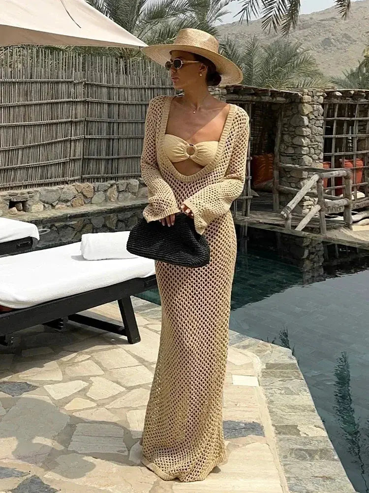 Model walking along the shore in the Whisper of Waves Crochet Maxi Cover-Up, capturing beachside elegance.