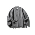 Urban Zen kimono cardigan displayed on a hanger, highlighting its substantial fabric perfect for winter fashion.