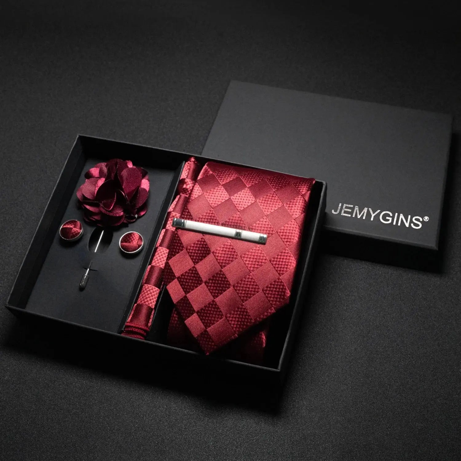 Pocket square from the wine-red paisley tie set in a stylish fold.