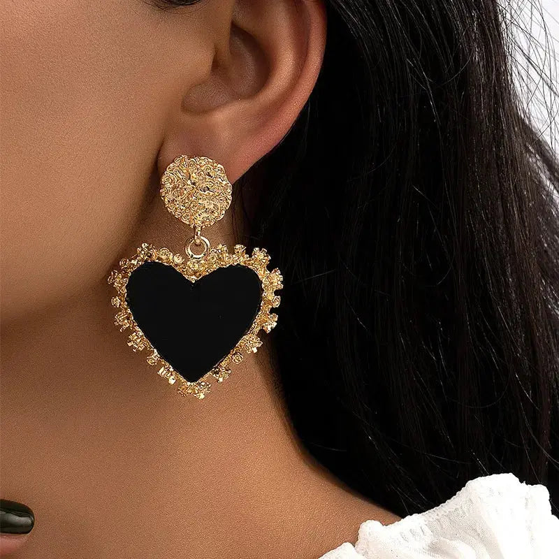 Stylish Heartfelt Whispers Dangle Earrings, combining vintage charm with modern elegance for any occasion.