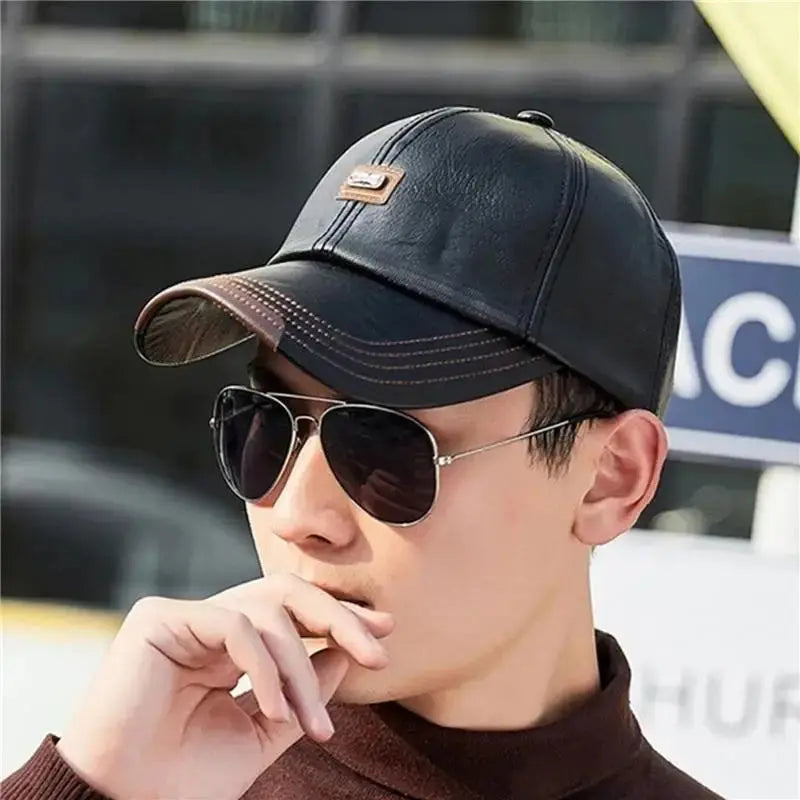 Durable black leather cap with a snug fit, ideal for outdoor events.