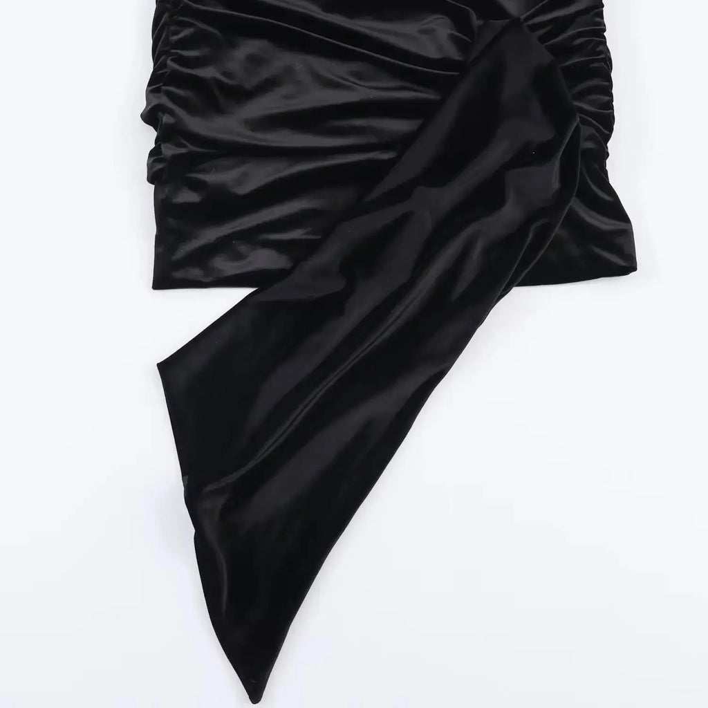 Side profile of the Midnight Charm Mini Dress, emphasizing the tailored waist and flattering empire silhouette.