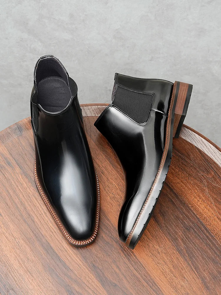 Side view of burgundy Chelsea boots displaying premium first-layer cowhide construction