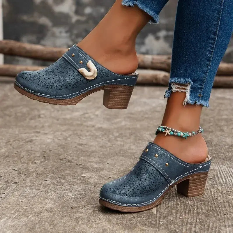 Chic black slingback heels with subtle metal decoration for stylish confidence.