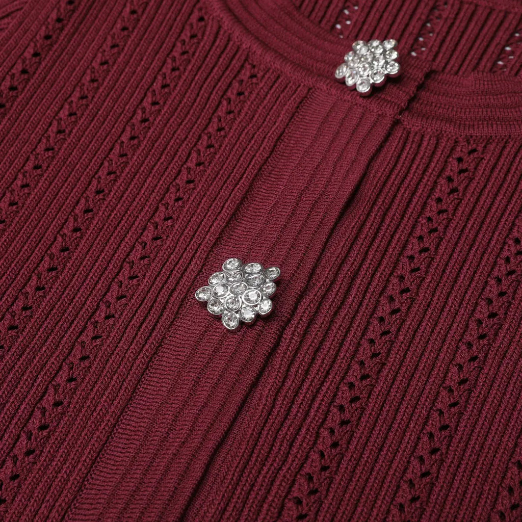 Close-up of the deep V-neck detail on the luxurious Evening Whispers mermaid dress.