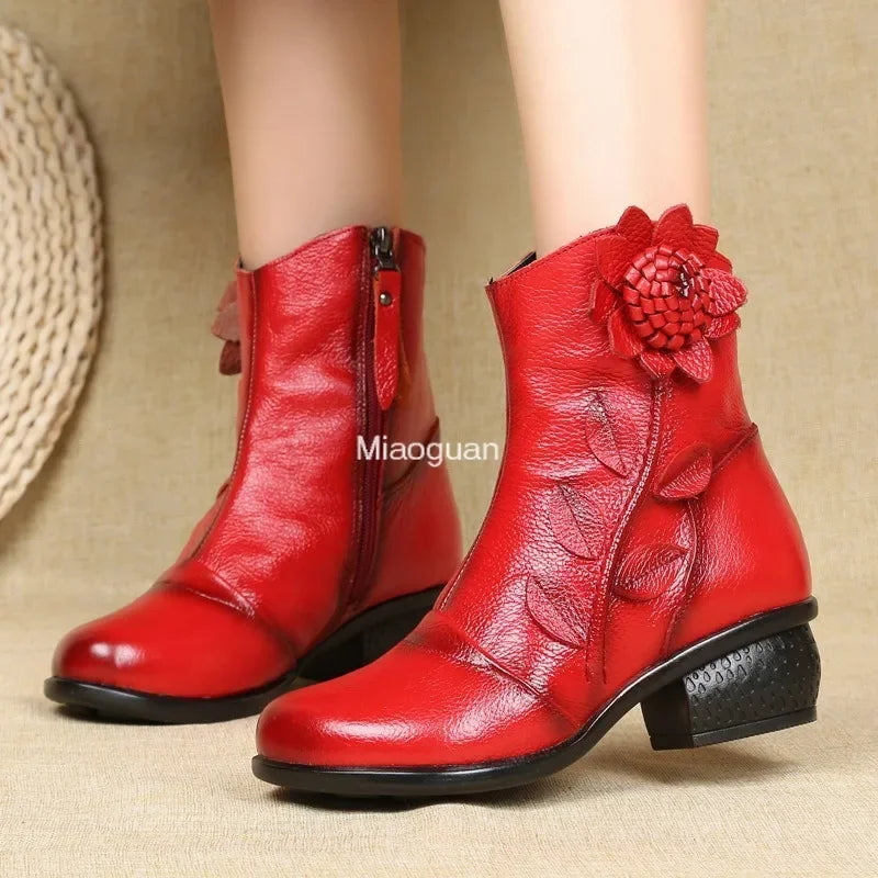 Vintage-inspired boots with bloom detailing, medium heel, and waterproof construction
