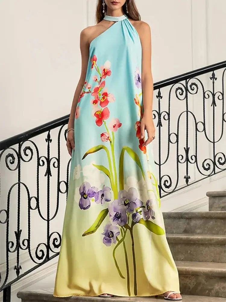 Sunset Hues Maxi Dress in vibrant floral print, featuring a halter neck and off-shoulder sleeves for summer elegance.