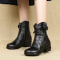 Mid-calf boots with delicate bloom artistry, side zip, and all-weather protection